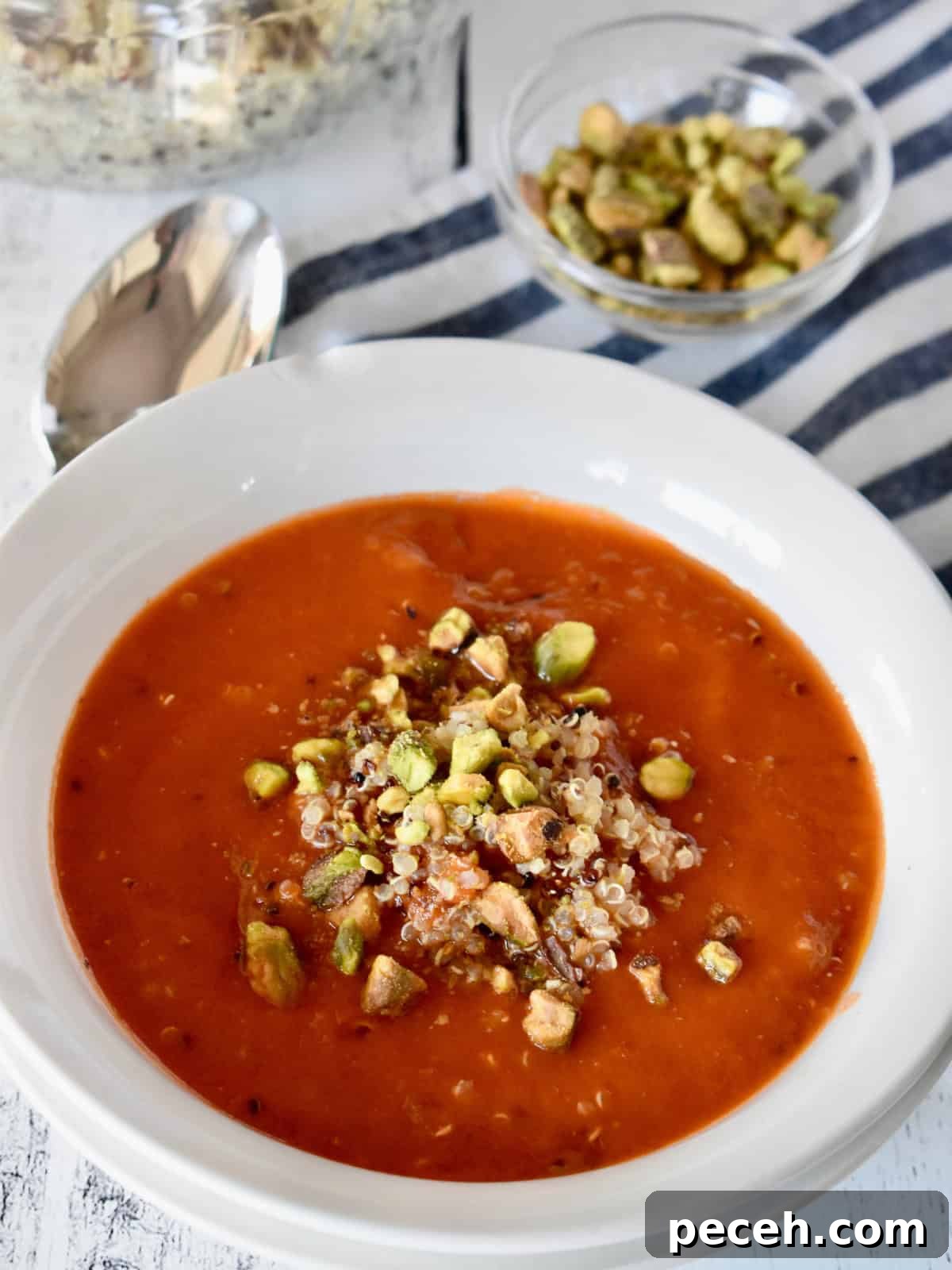 20-Minute Tomato Quinoa Soup Recipe for Weeknight Dinners 2 Tomato Quinoa Soup in a white bowl.