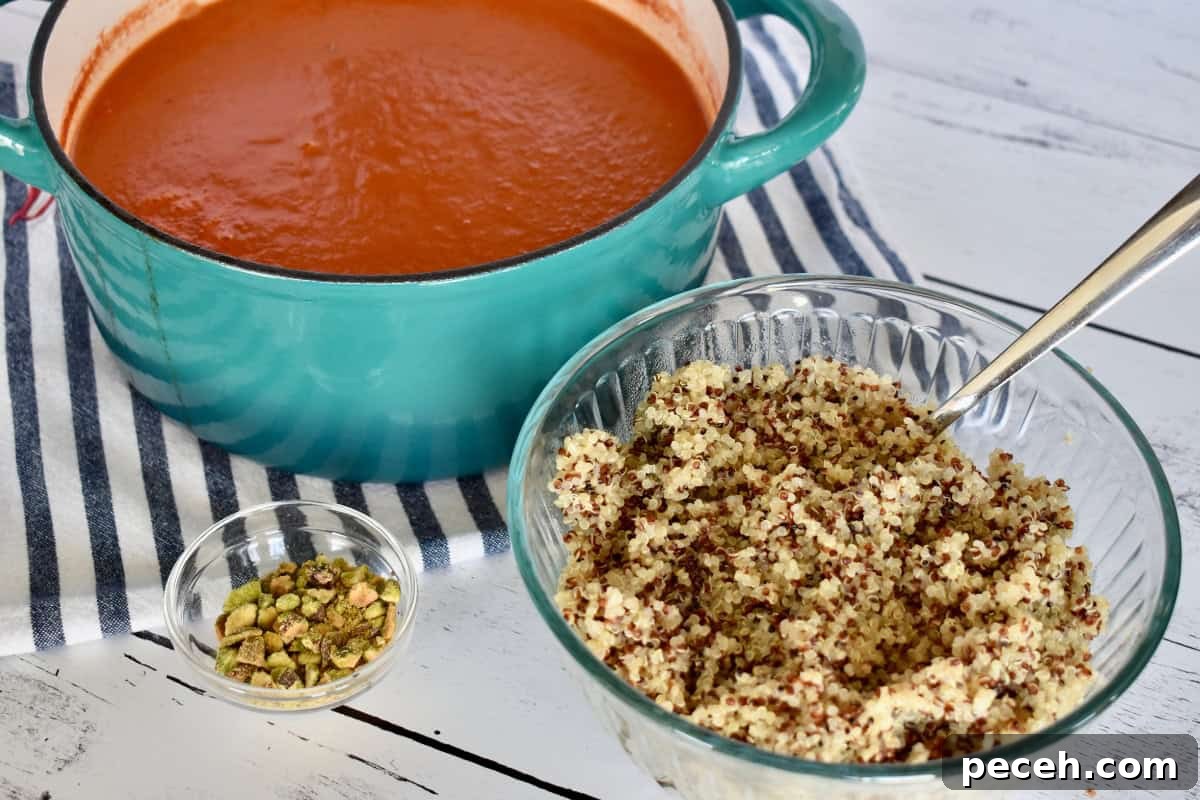 20-Minute Tomato Quinoa Soup Recipe for Weeknight Dinners 6 Bowl of quinoa, tomato soup, and pistachios.
