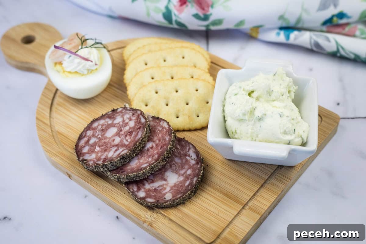 17 Mother’s Day Brunches You Can Enjoy Without Reservations or Parking Hassles 15 A wooden board with sliced salami, crackers, a deviled egg, and a square dish of homemade Boursin cheese.