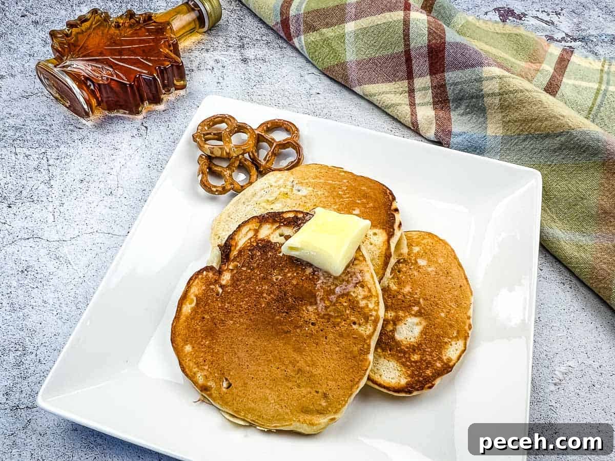 17 Mother’s Day Brunches You Can Enjoy Without Reservations or Parking Hassles 5 Pretzel pancakes with a bottle of maple syrup nearby.