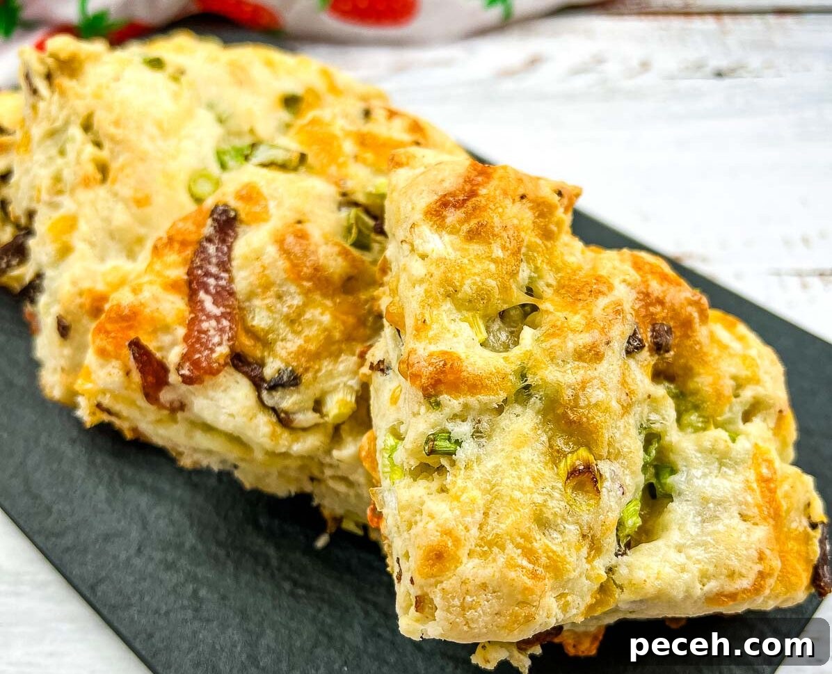 17 Mother’s Day Brunches You Can Enjoy Without Reservations or Parking Hassles 7 Bacon, Cheddar, Green Onion Scones on a black plate.