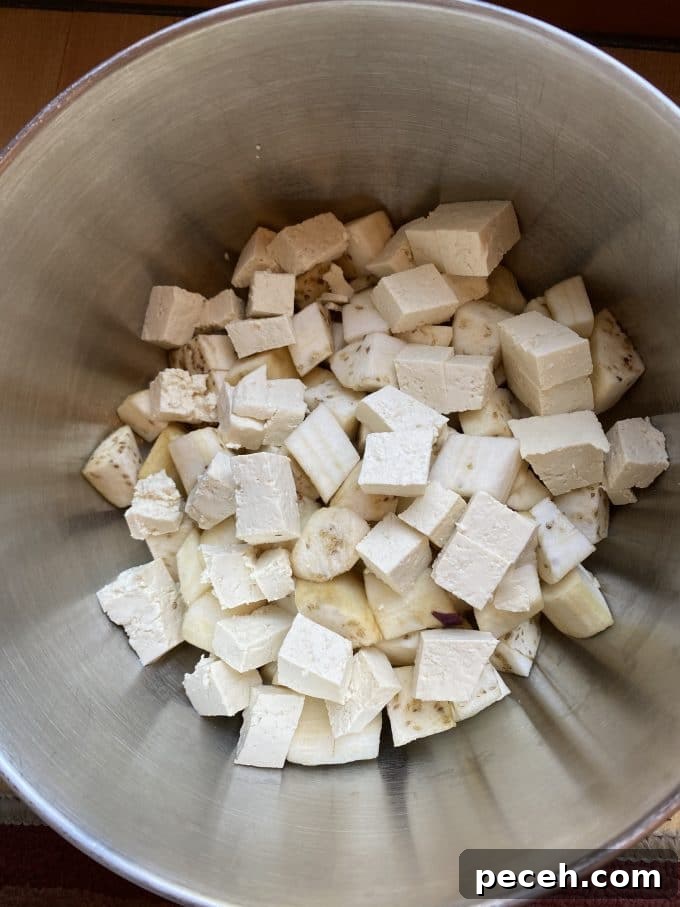 A bowl filled with diced tofu