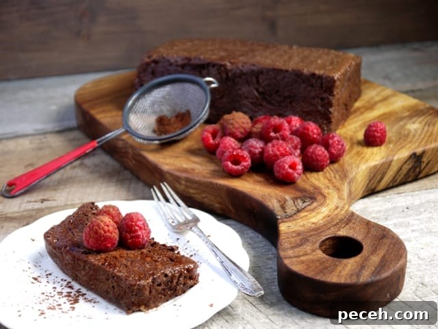 Romantic Date Night Dinner Recipes for Two 6 A wooden board with a French dessert called Chocolate Marquise and fresh raspberries on