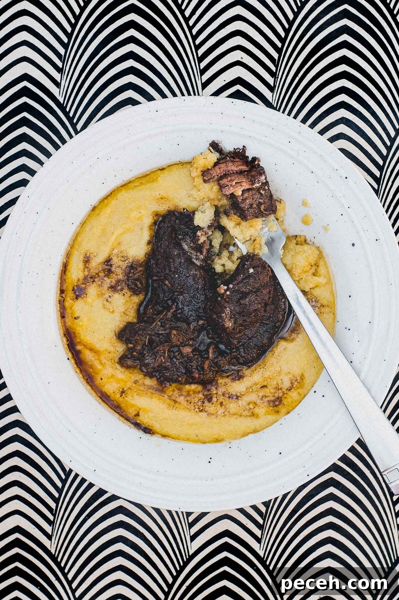 Peposo Alla Fornacina (Tuscan Beef Stew) | cookeatworld.com A bowl of Creamy Polenta with Peposo Alla Fornacina (Tuscan Beef Stew)