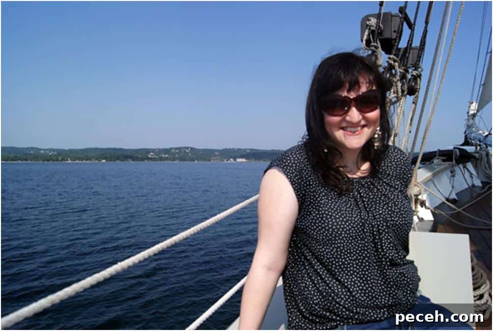 Discover Michigan: Road Trips, Lakes and Outdoor Activities 2 Heather sitting on the side of a boat