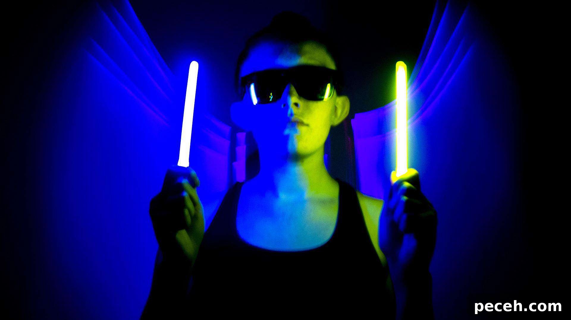 17 Fun and Memorable 13th Birthday Party Ideas 11 Young boy holding two glow in the dark sticks.