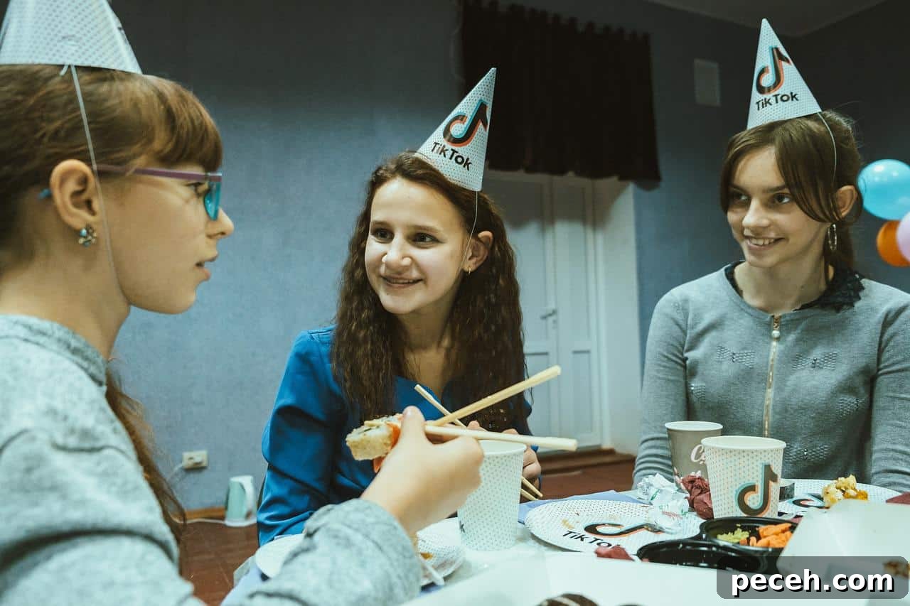 17 Fun and Memorable 13th Birthday Party Ideas 3 Three teen girls celebrating at a TikTok themed party.