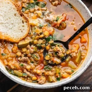 Hearty Sausage and Lentil Soup Recipe for Cozy Weeknights 6 Featured image showing sausage lentil soup in white bowl with slice of bread.