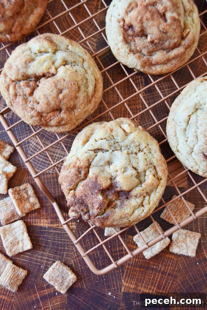 cinnamon toast crunch cookies on a wire rack with cereal pieces