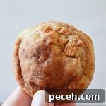 author holding a cinnamon toast crunch cookie