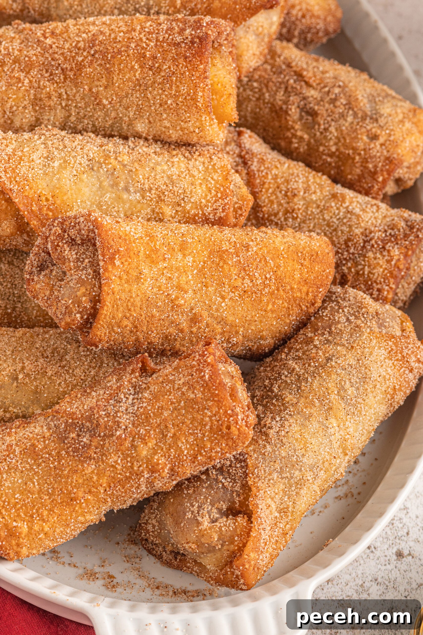 Crispy Apple Pie Egg Rolls with Cinnamon Sugar Dip 8 Close up of the cinnamon sugar coating of the dessert egg rolls.