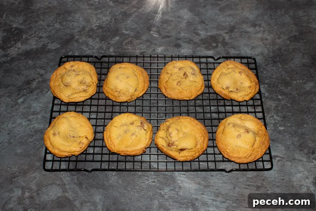 Crème Egg Cookie Recipe: Gooey Chocolate and Cadbury Filling 19 Creme Egg cookies cooling on a wire rack