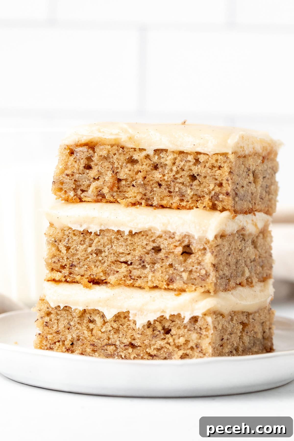 Moist Banana Bars with Cream Cheese Frosting Recipe 6 Stack of three banana bars with cream cheese frosting