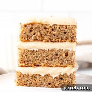 Moist Banana Bars with Cream Cheese Frosting Recipe 7 Three banana bars with cream cheese frosting, one on top of each other