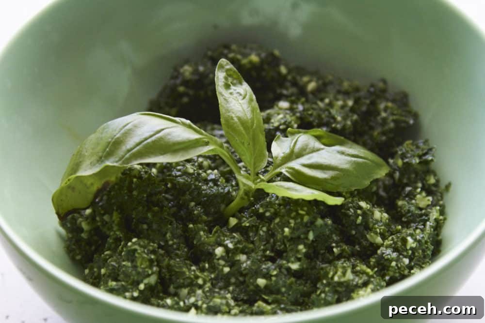 Kale and Walnut Pesto Recipe — Bright Sauce for Pasta & Toast 6 Kale pesto in a green bowl.