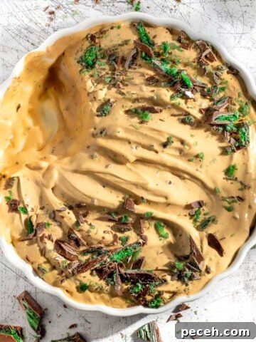 Peppermint crisp tart in a large round white dish.