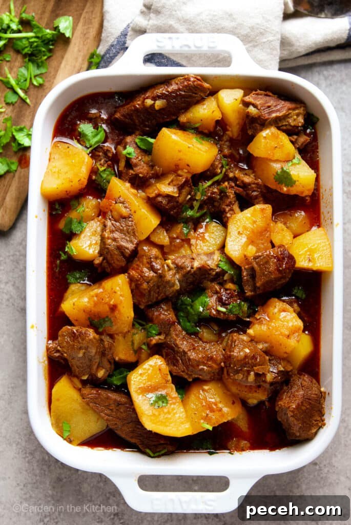 Carne de Panela (Brazilian Stew Beef) — Authentic Recipe and Tips 3 Beef and potatoes in a pot