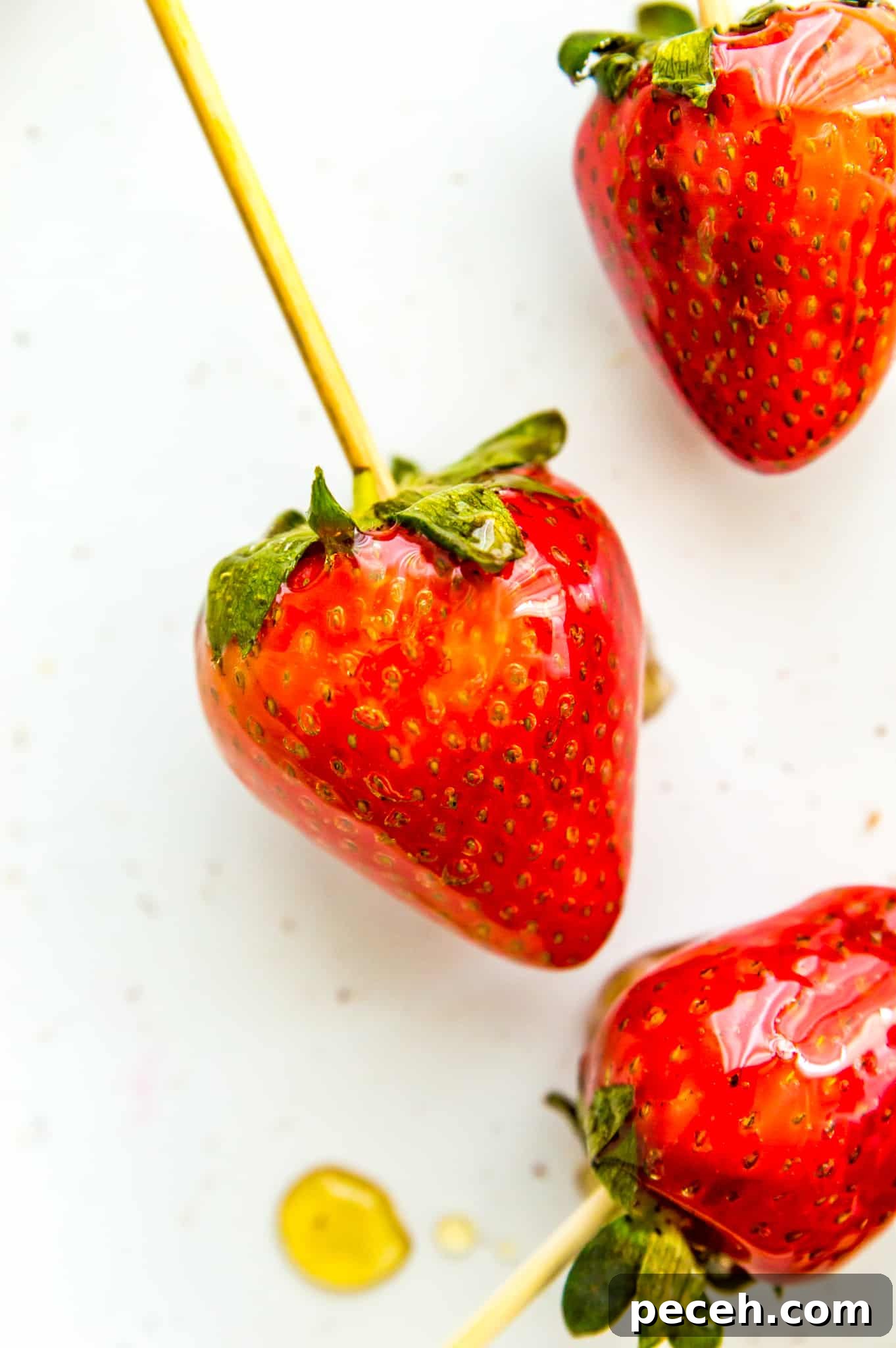 Tanghulu Candied Fruit Recipe — 3 Ingredients, Traditional Street Snack 6 A candied strawberry on a bamboo skewer.