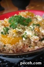 Bowl of mandarin quinoa salad with balsamic dressing.