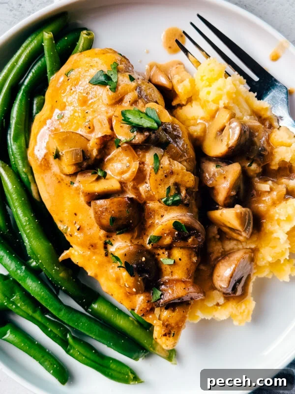 Classic Chicken Piccata Recipe with Lemon & Capers 12 A plate of chicken Marsala with green beans and mashed potatoes.