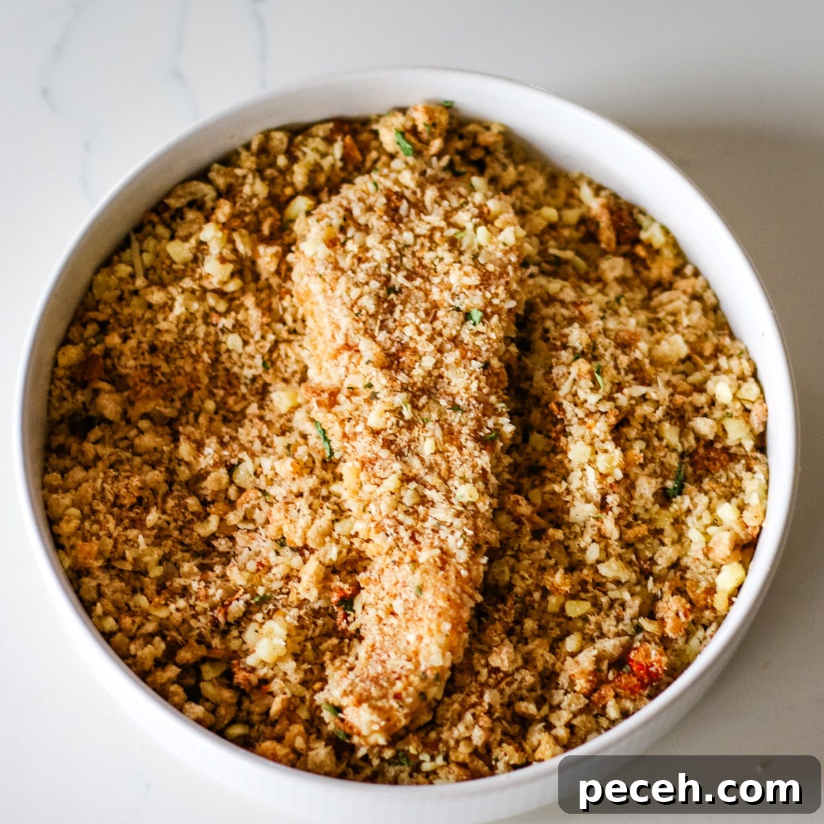 chicken cutlets coated in crumbs.