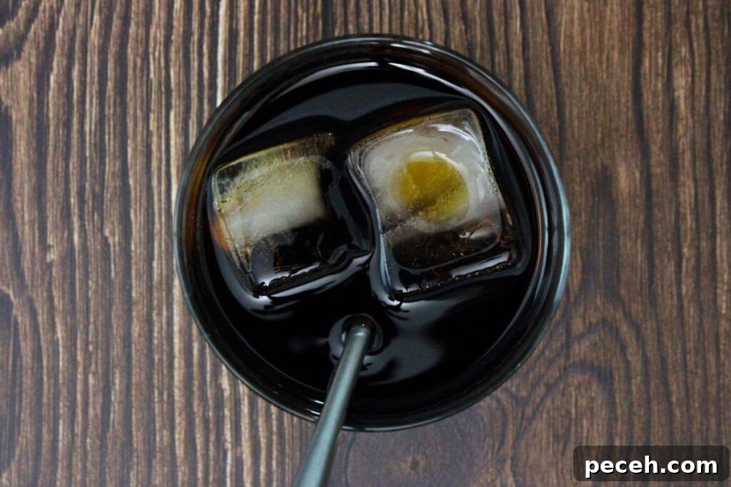 Black Manhattan Cocktail: A Bold, Smoky Twist on the Classic 5 add all black manhattan ingredients to a glass with ice and stir