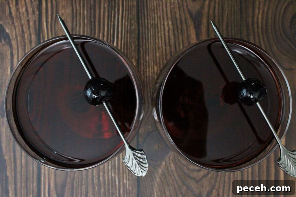 Black Manhattan Cocktail: A Bold, Smoky Twist on the Classic 7 garnish black manhattans with luxardo cherry