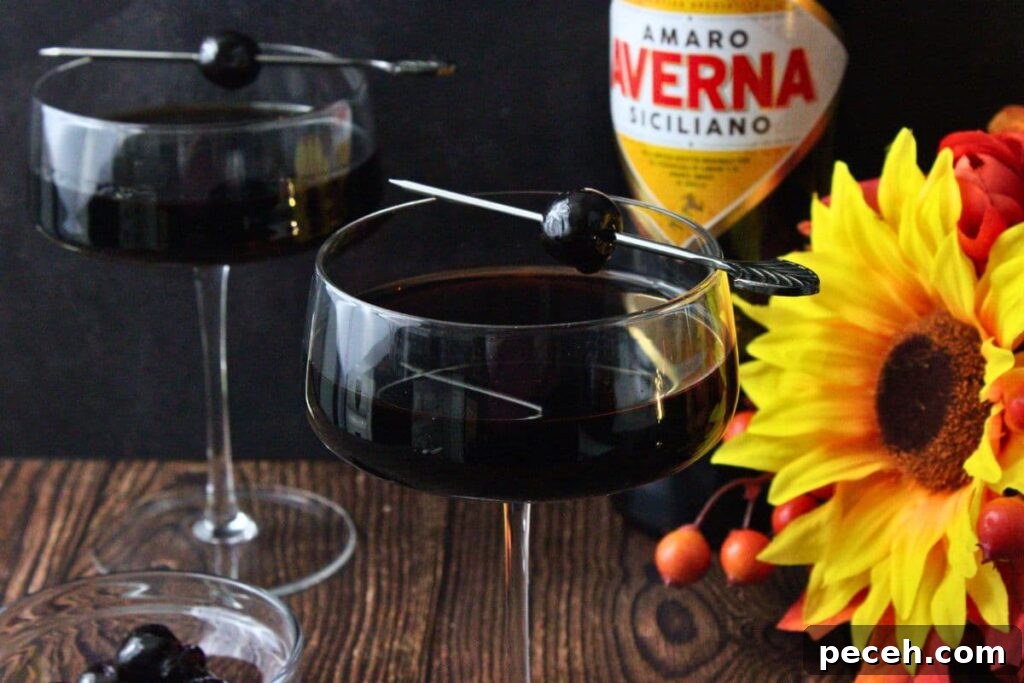 Black Manhattan Cocktail: A Bold, Smoky Twist on the Classic 8 two black manhattan drinks in front of amaro bottle