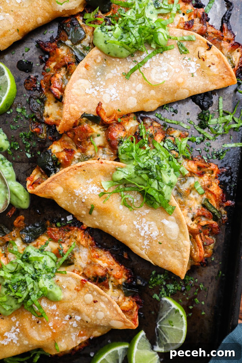 Crispy Poblano Chicken Tacos with Avocado Jalapeño Salsa 7 A close up photo of a crispy poblano chicken taco topped with avocado-jalapeño salsa and shredded lettuce