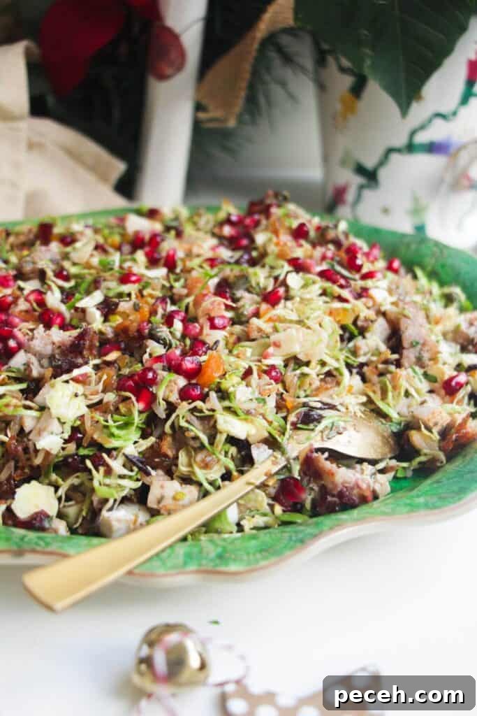 Cranberry-Dressed Crispy Rice Salad for Holiday Gatherings 9 Festive crispy rice salad on a large green platter.