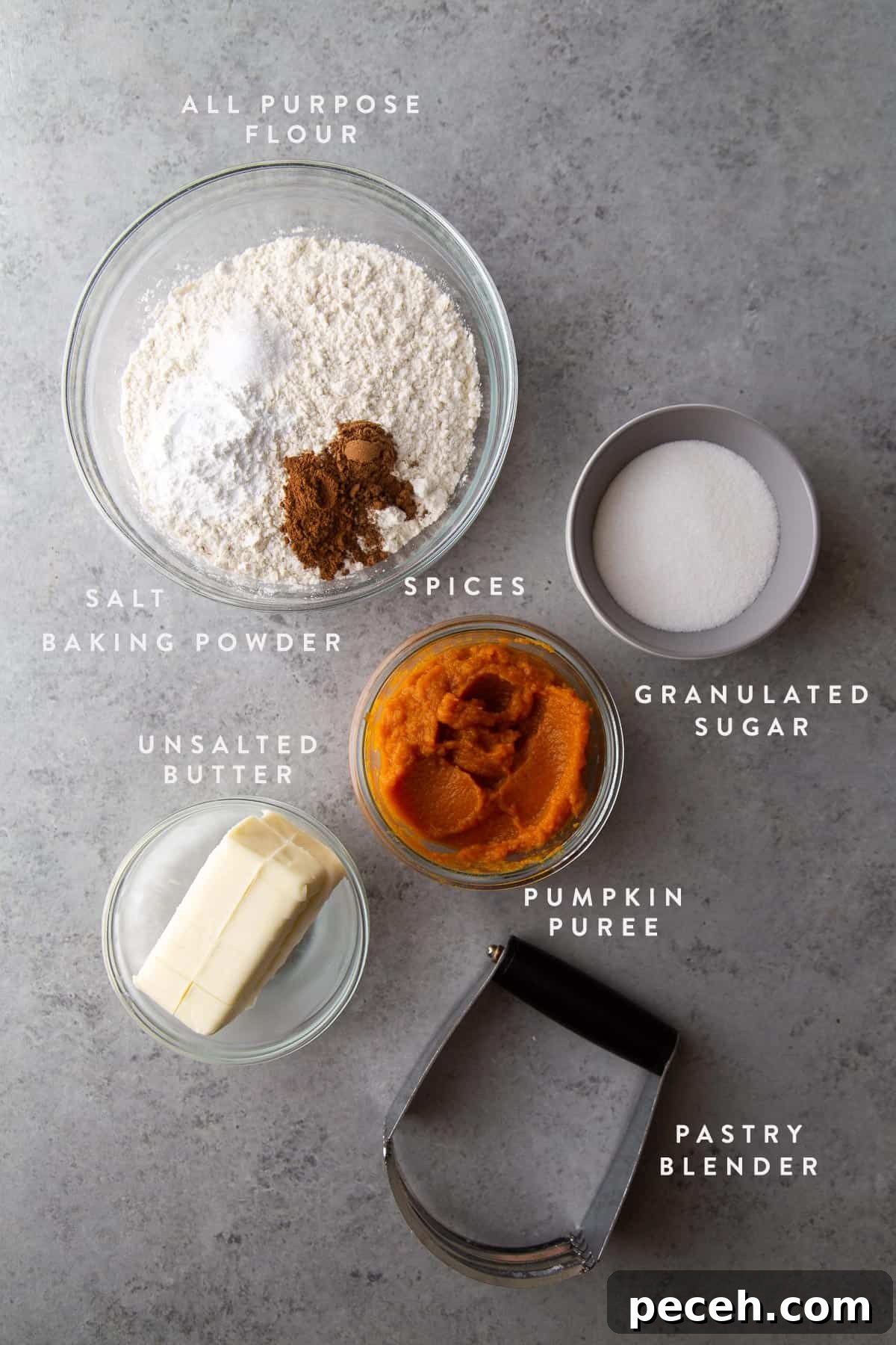 Maple-Glazed Pumpkin Scones Recipe for Fall Baking 5 pumpkin scone ingredients including pumpkin puree, butter, sugar, and flour.