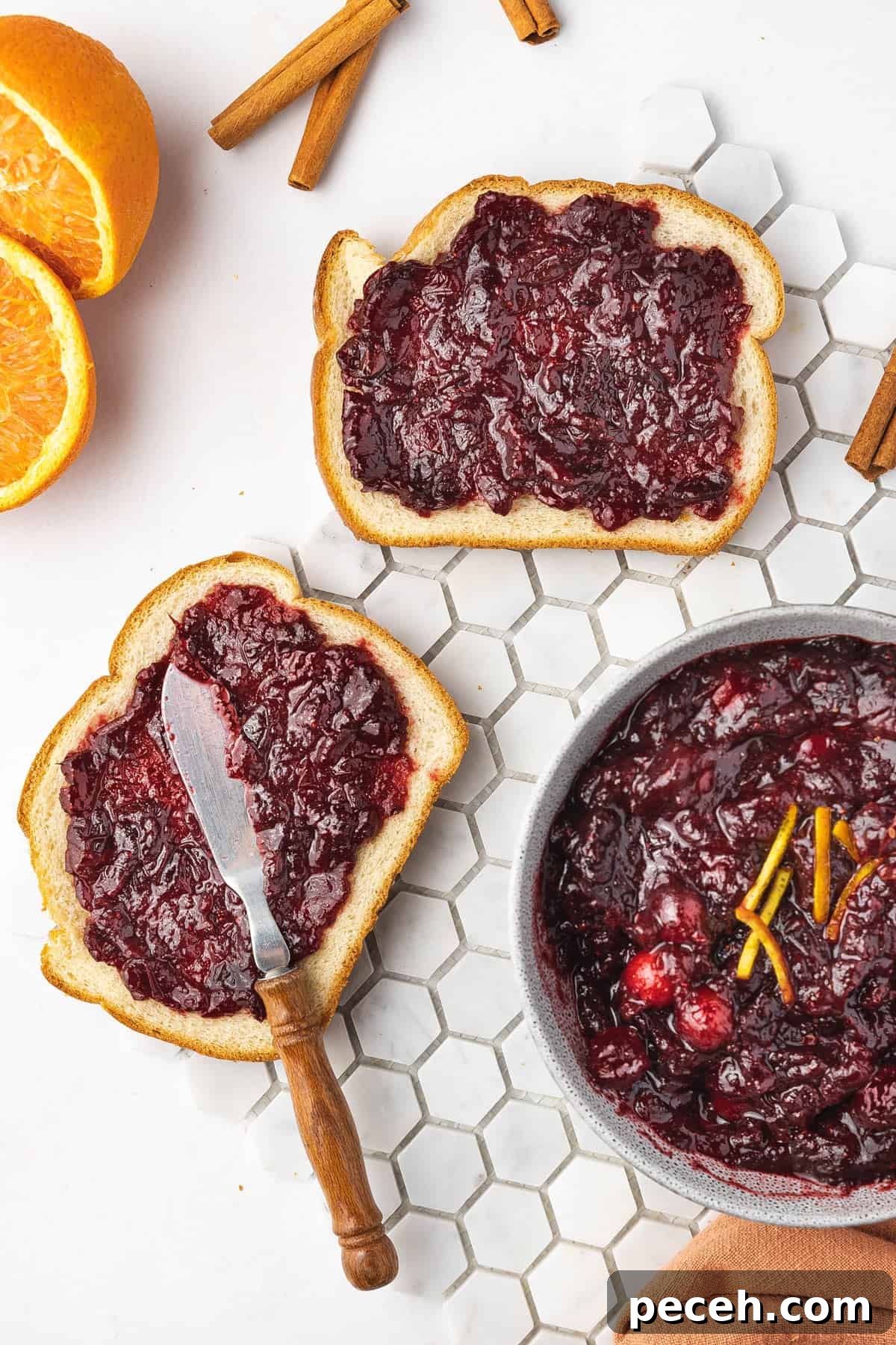 Slow Cooker Cranberry Sauce Recipe for Thanksgiving 9 Overhead view of two slices of bread with cranberry sauce spread on them.
