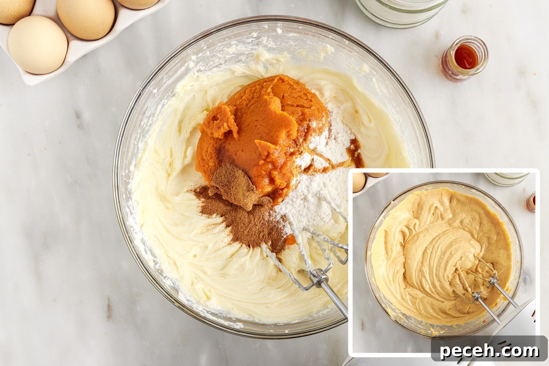 Pumpkin puree, flour, and spices added to mixing bowl and combined pumpkin cheesecake batter.