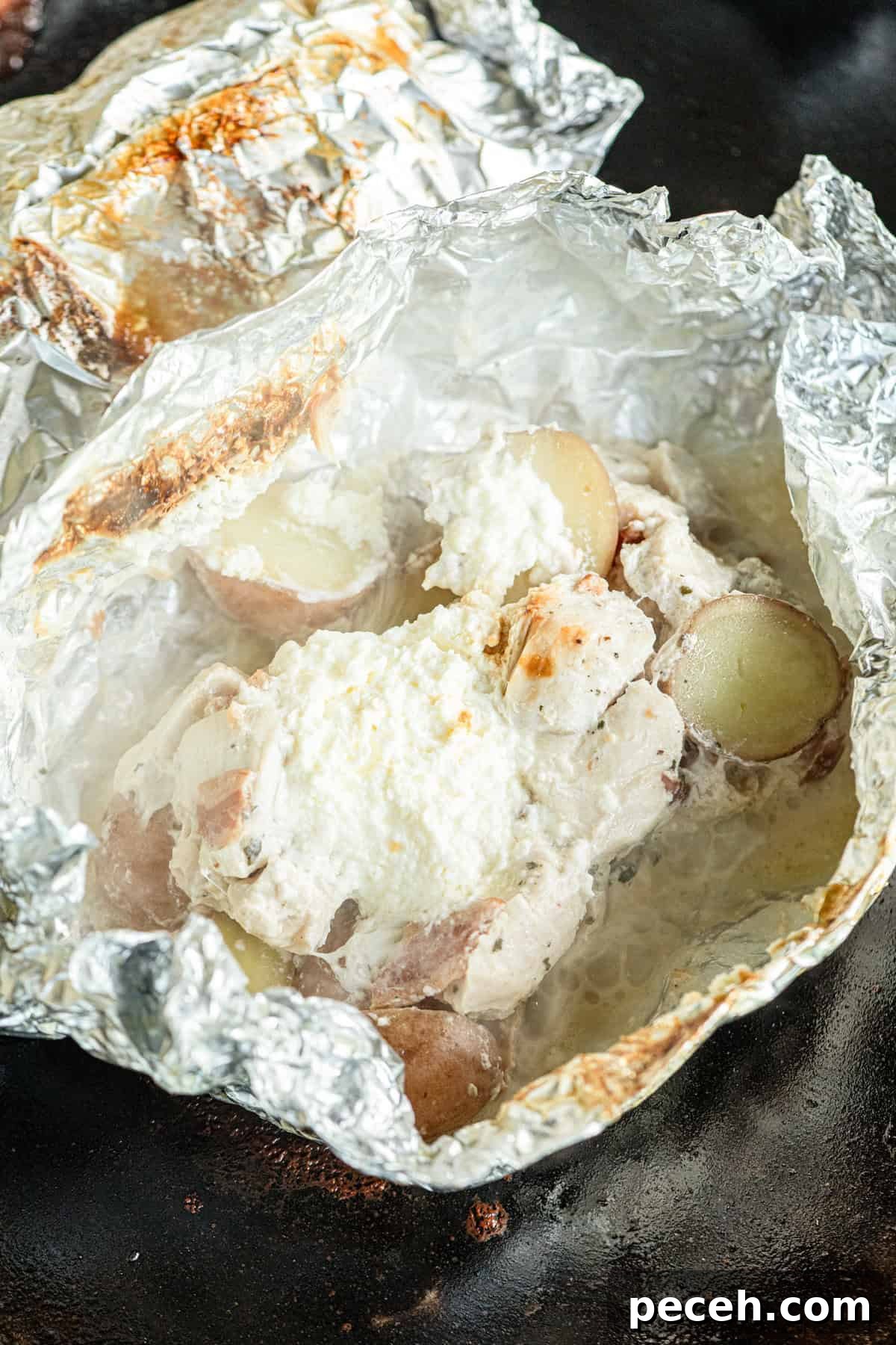 Cheesy Crack Chicken Foil Packet Dinner Recipe 8 Opening Crack Chicken Foil Packet before adding shredded cheese