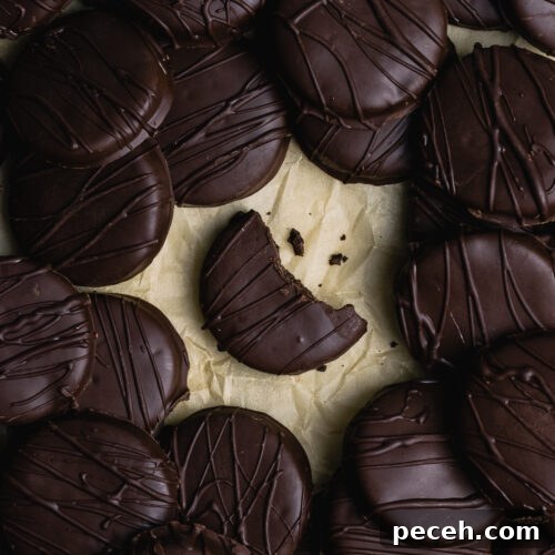 A pile of gluten free thin mint cookies on a table.