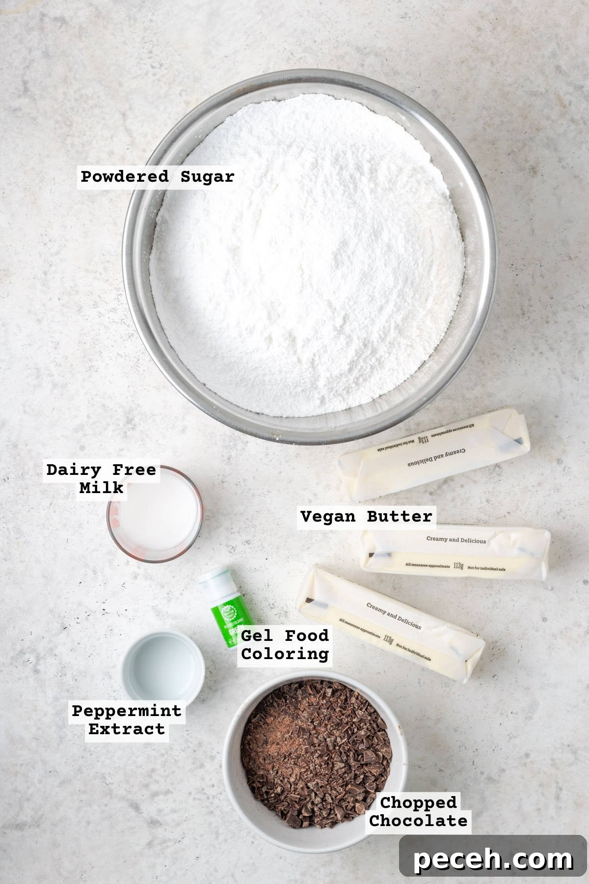 Mint Chocolate Chip Frosting Recipe for Smooth, Creamy Results 3 Ingredients for mint chocolate chip frosting on a white table.