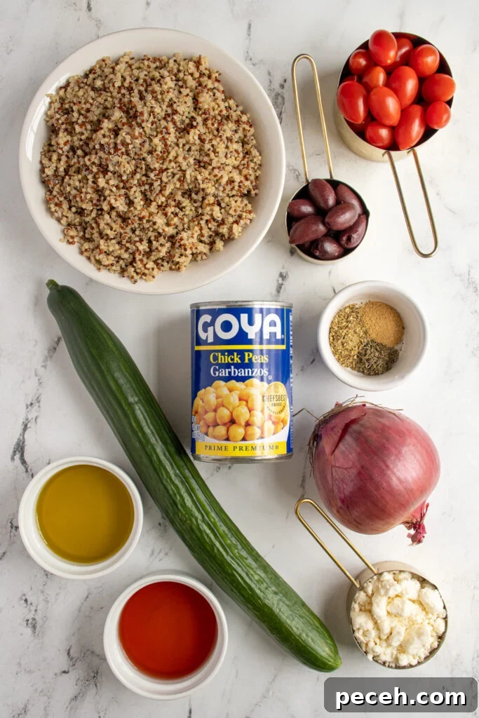 Greek Quinoa and Chickpea Salad with Feta and Olives 4 Ingredients for greek quinoa chickpea salad laid out on a tabletop.