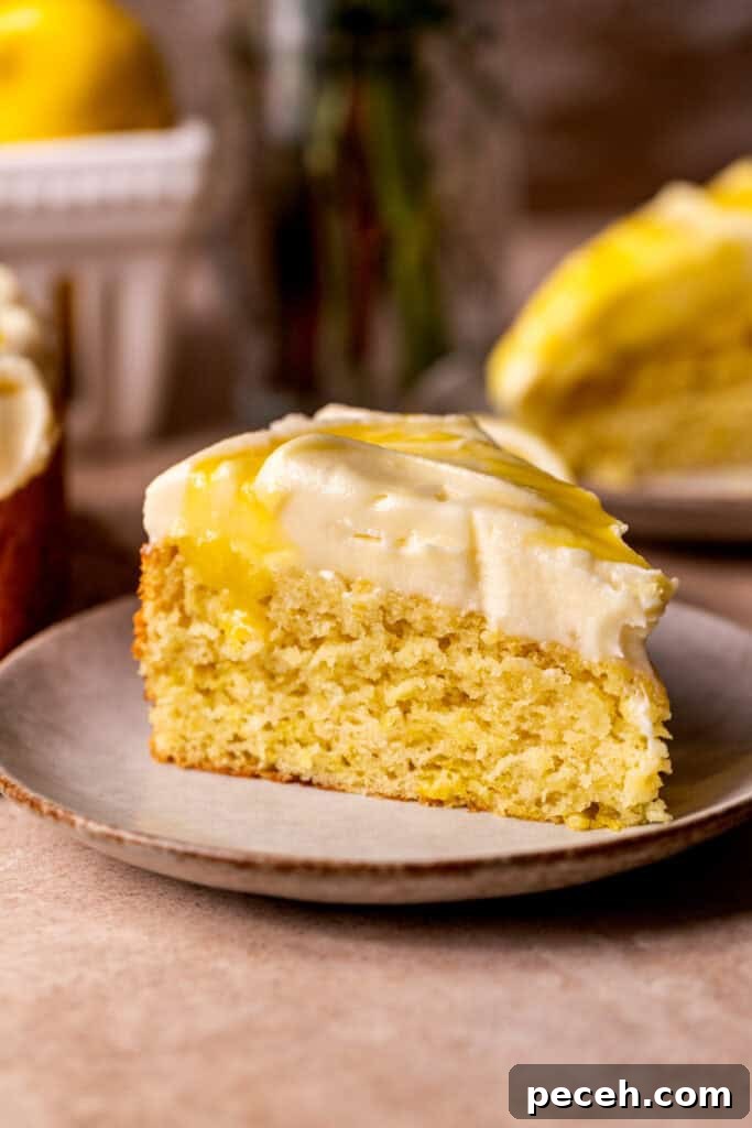 Slice of lemon curd cake on a plate.