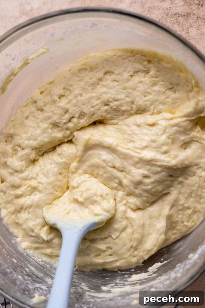Lemon cake batter in a glass bowl.