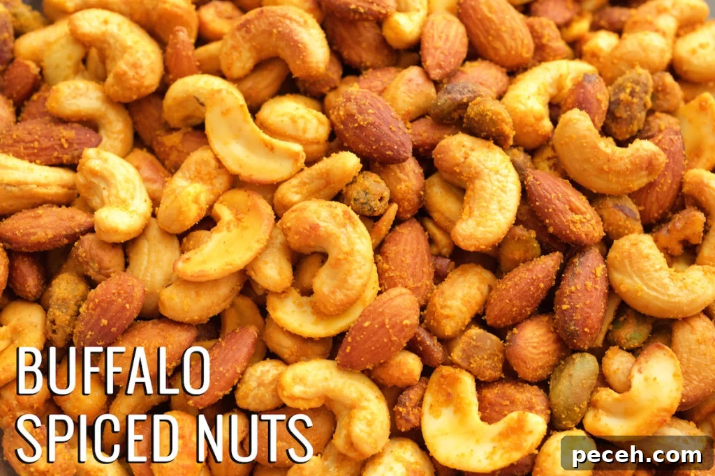 Close up of homemade buffalo flavored nuts. Text in the bottom left corner reads "Buffalo Spiced Nuts".
