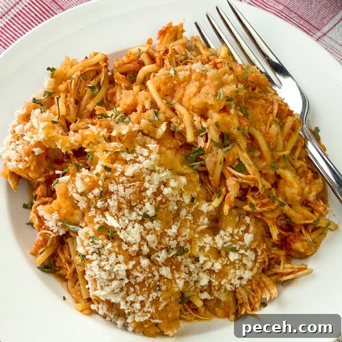 One-Pot Slow Cooker Chicken Parmesan Recipe 12 Cheesy chicken parmesan with a fork and light coating of bread crumbs with Italian seasoning