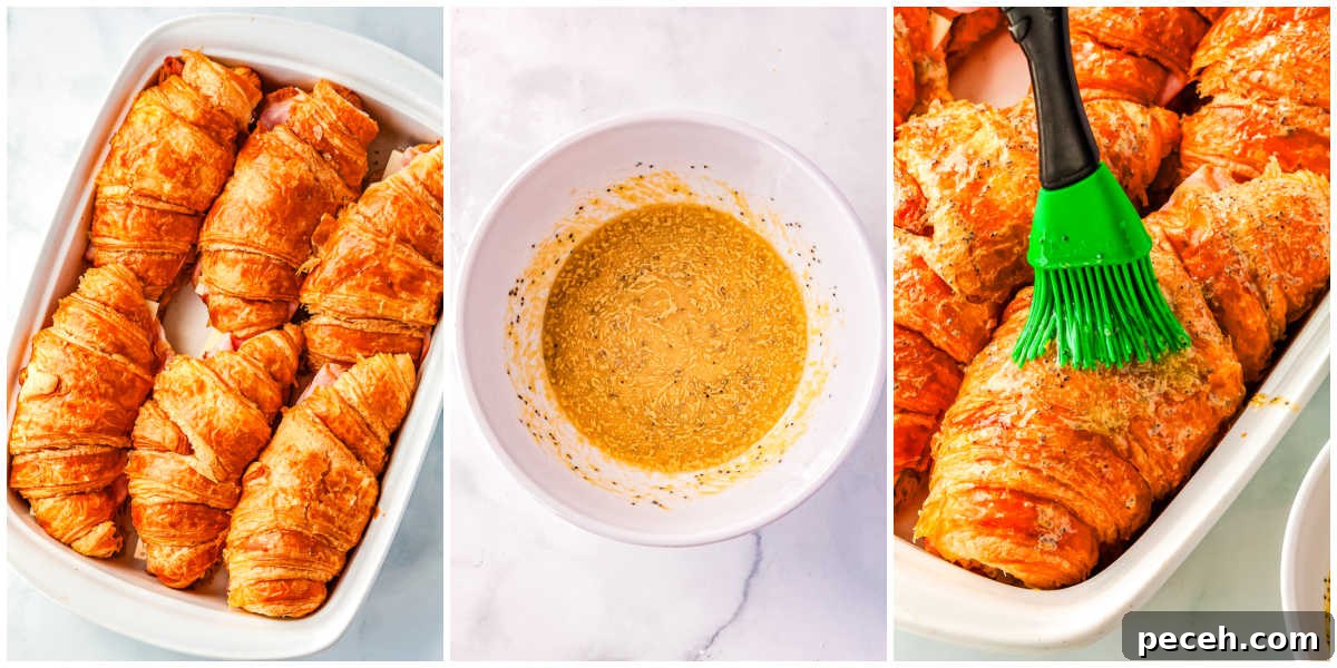The assembled sandwiches brushed with a buttery poppyseed topping.