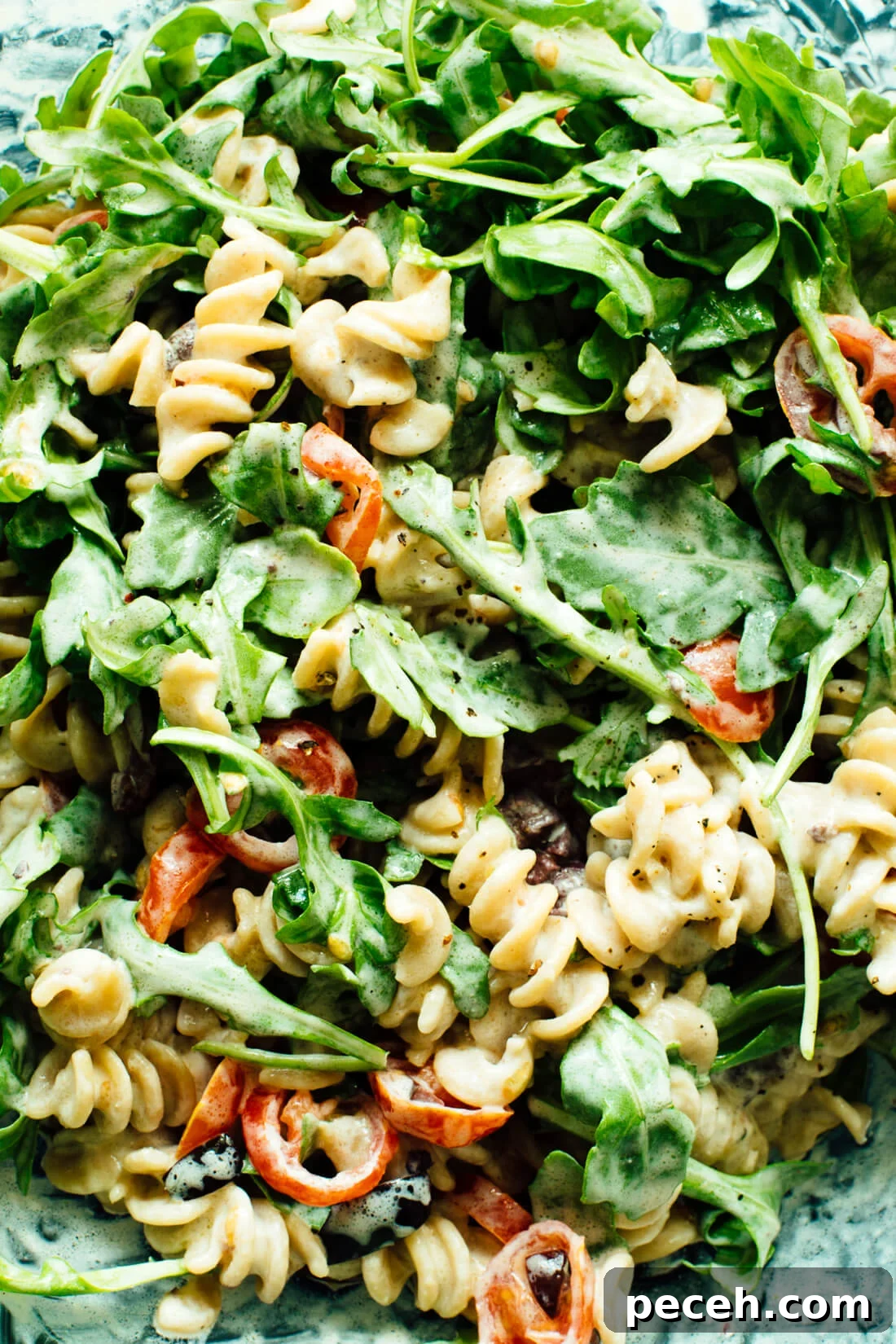 10 Spring Recipes to Try from Love Real Food 5 Creamy Arugula, Goat Cheese, and Tomato Pasta Salad