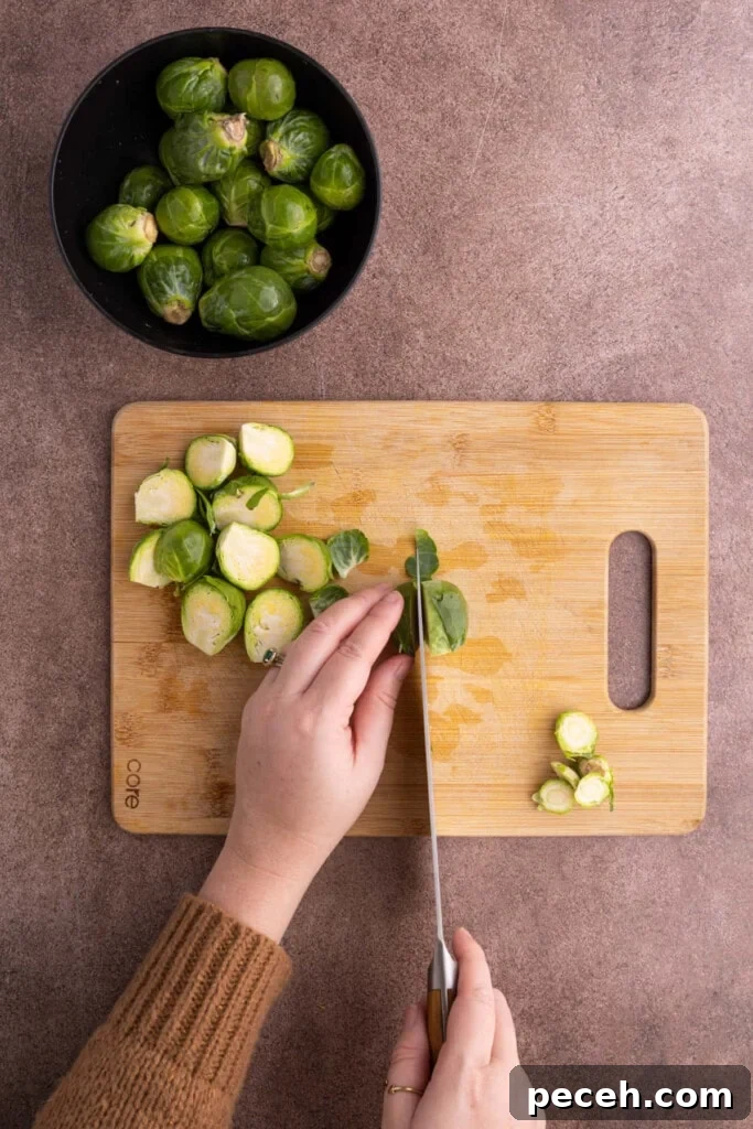 Maple-Balsamic Roasted Brussels Sprouts Recipe for Fall sides 5 Prepping brussels sprouts to make Maple Balsamic Brussels Sprouts.