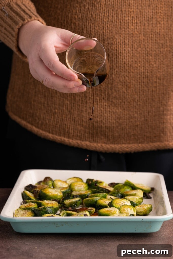 Maple-Balsamic Roasted Brussels Sprouts Recipe for Fall sides 8 Adding balsamic vinegar to roasted brussels sprouts.