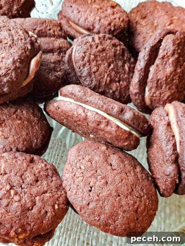 A pile of romany creams on a glass platter.