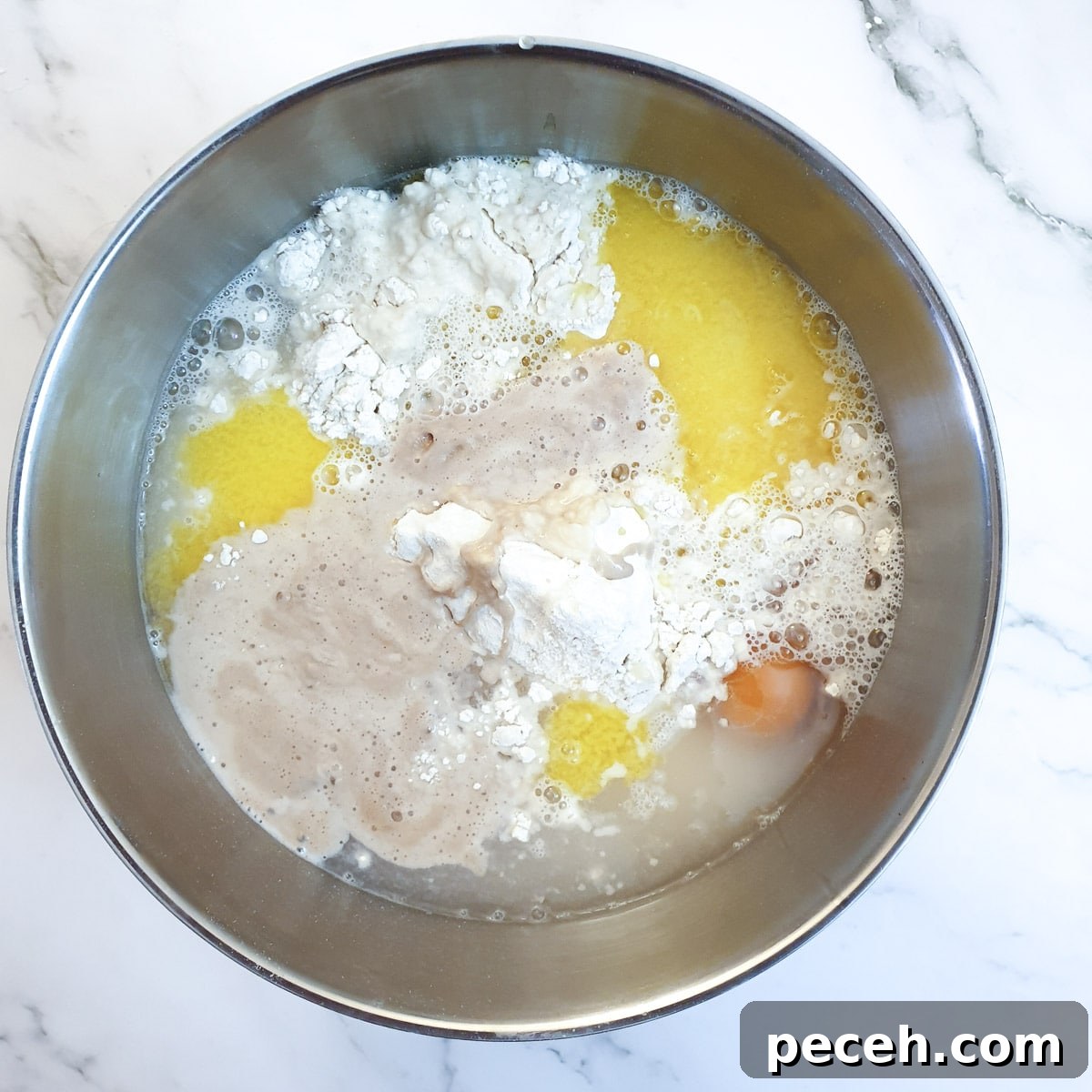 Mosbolletjies (Condensed Milk Rusks): South African Sweet Biscuits 6 Ingredients for condensed milk rusks in a mixing bowl.