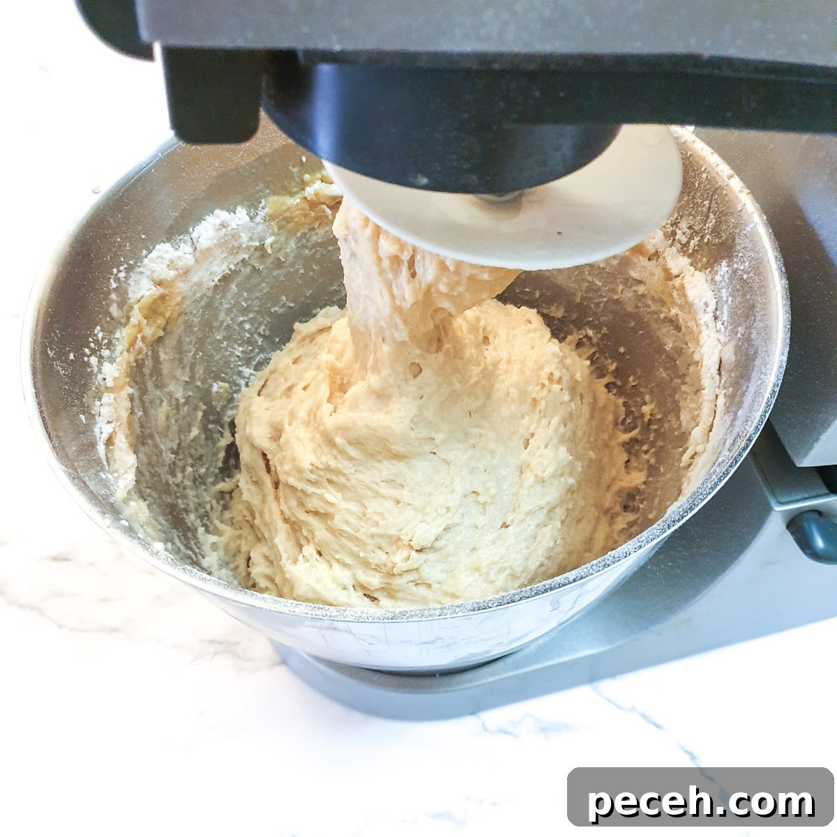 Mosbolletjies (Condensed Milk Rusks): South African Sweet Biscuits 7 Dough being mixed in a stand mixer.