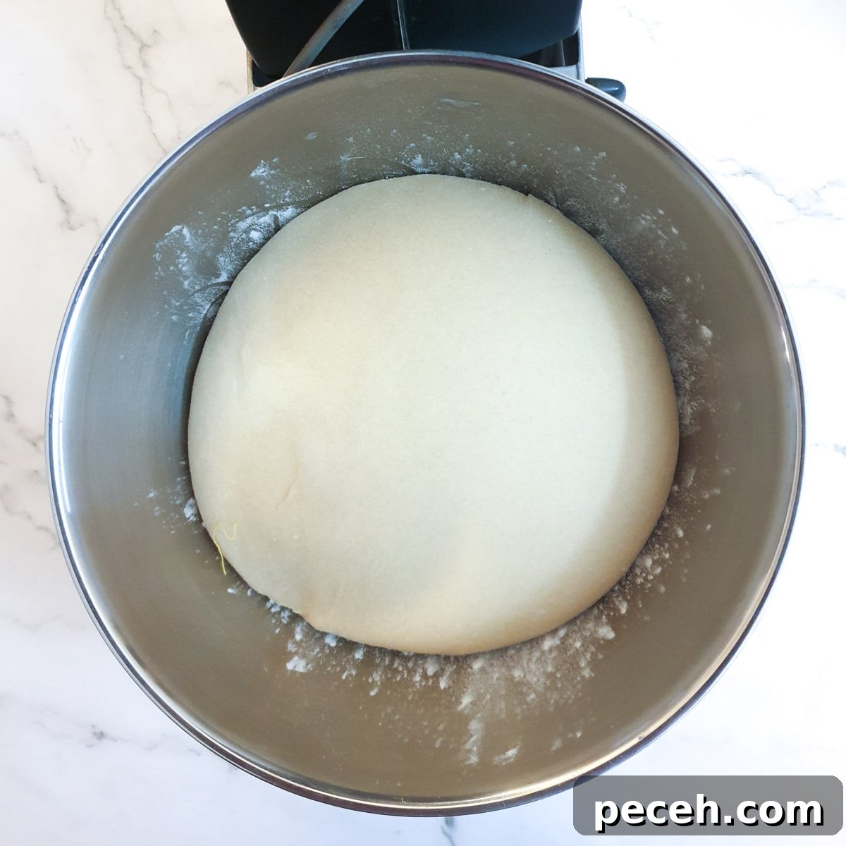 Mosbolletjies (Condensed Milk Rusks): South African Sweet Biscuits 9 A ball of dough after it has risen and doubled in size.