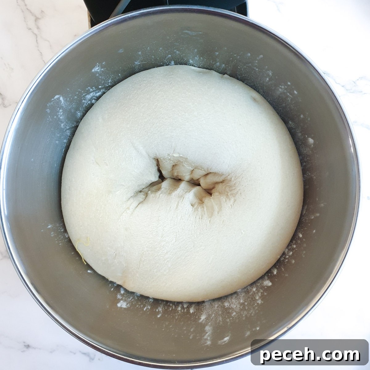 Mosbolletjies (Condensed Milk Rusks): South African Sweet Biscuits 10 A ball of dough being punched down.